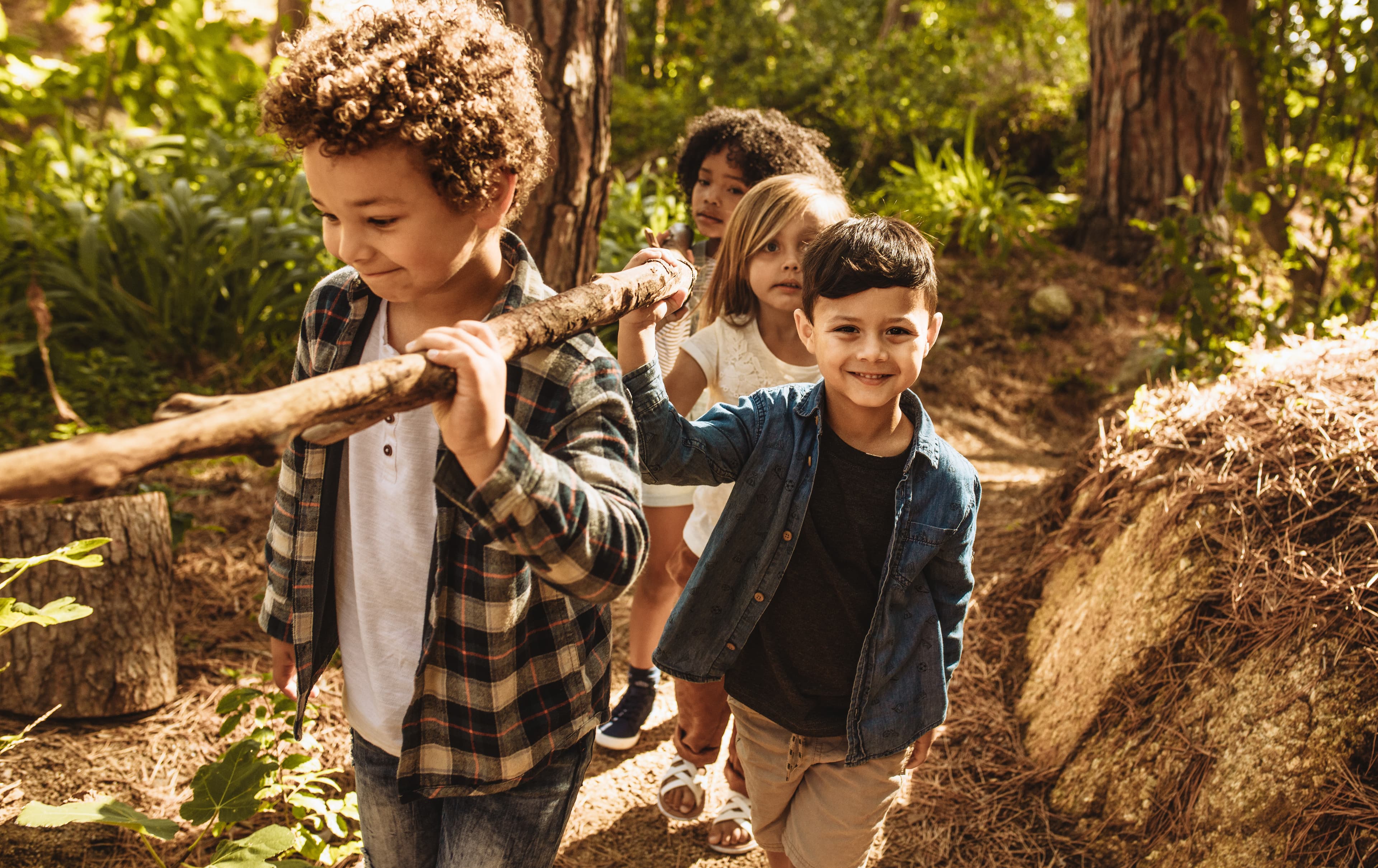 Children exploring and playing in a sensory-rich natural outdoor environment